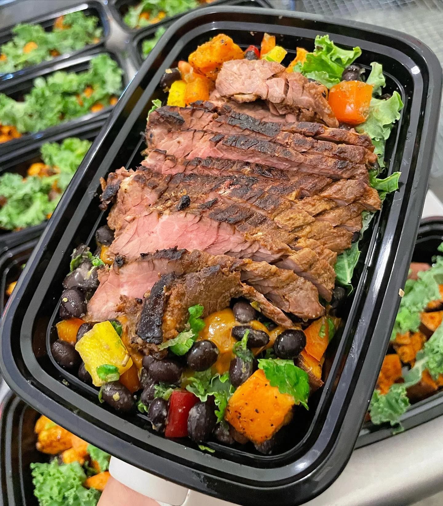 NE TIME Meals carne asada sweet potato bowl with sliced steak, black beans, and vegetables